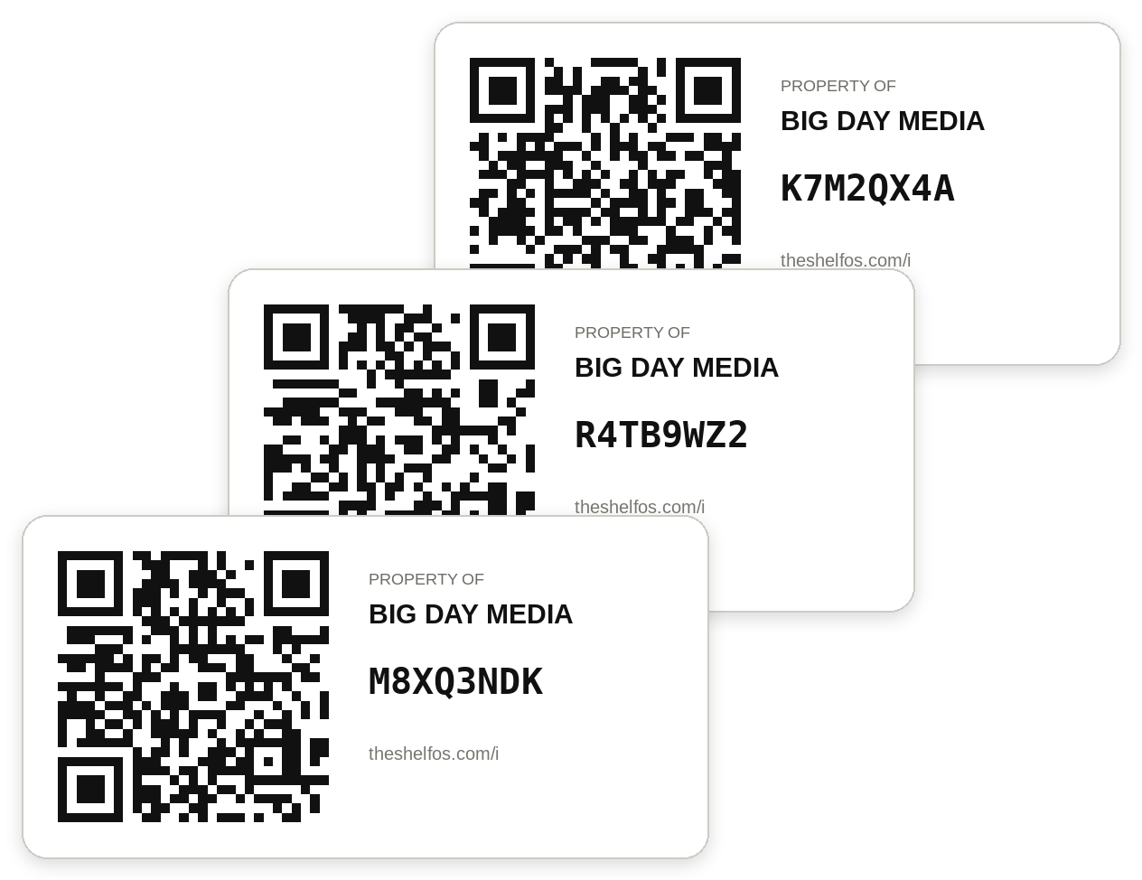 Three QR asset labels, each printed with a unique code.